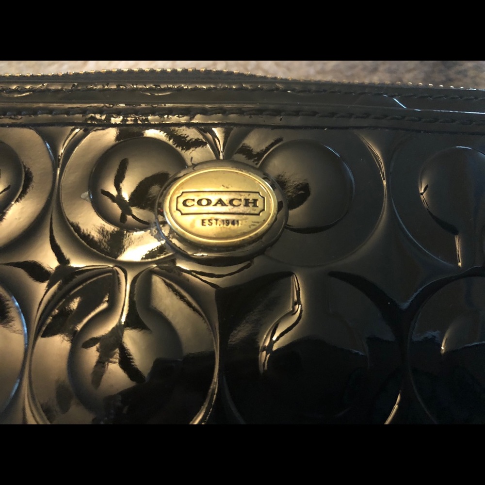 Coach black patent leather wristlet.